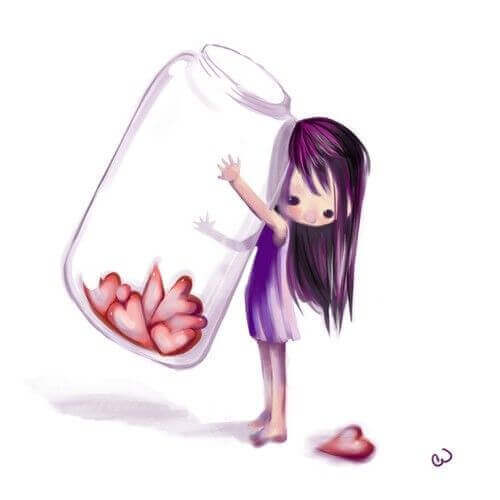 Dziewczynka trzyma słoik z sercami - miłość