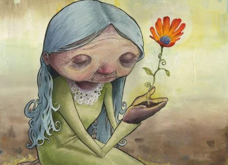 Starsza kobieta z kwiatkiem