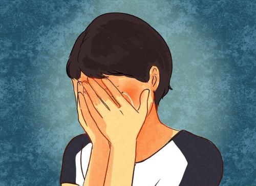 Kobieta trzyma się za twarz - zaburzenie afektywne dwubiegunowe